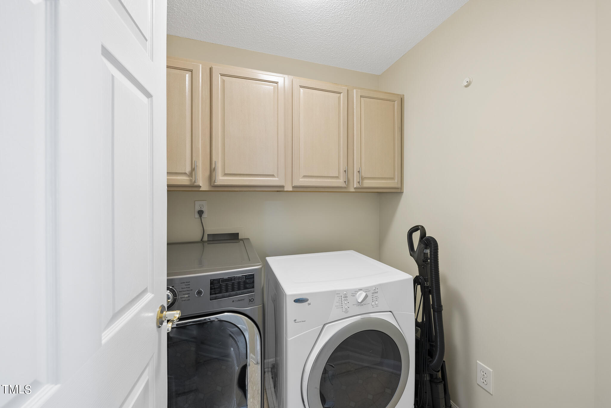 9013 Miranda Drive Raleigh, NC 27617 - Photo 32 of 41 a view of storage and utility room with washer and dryer