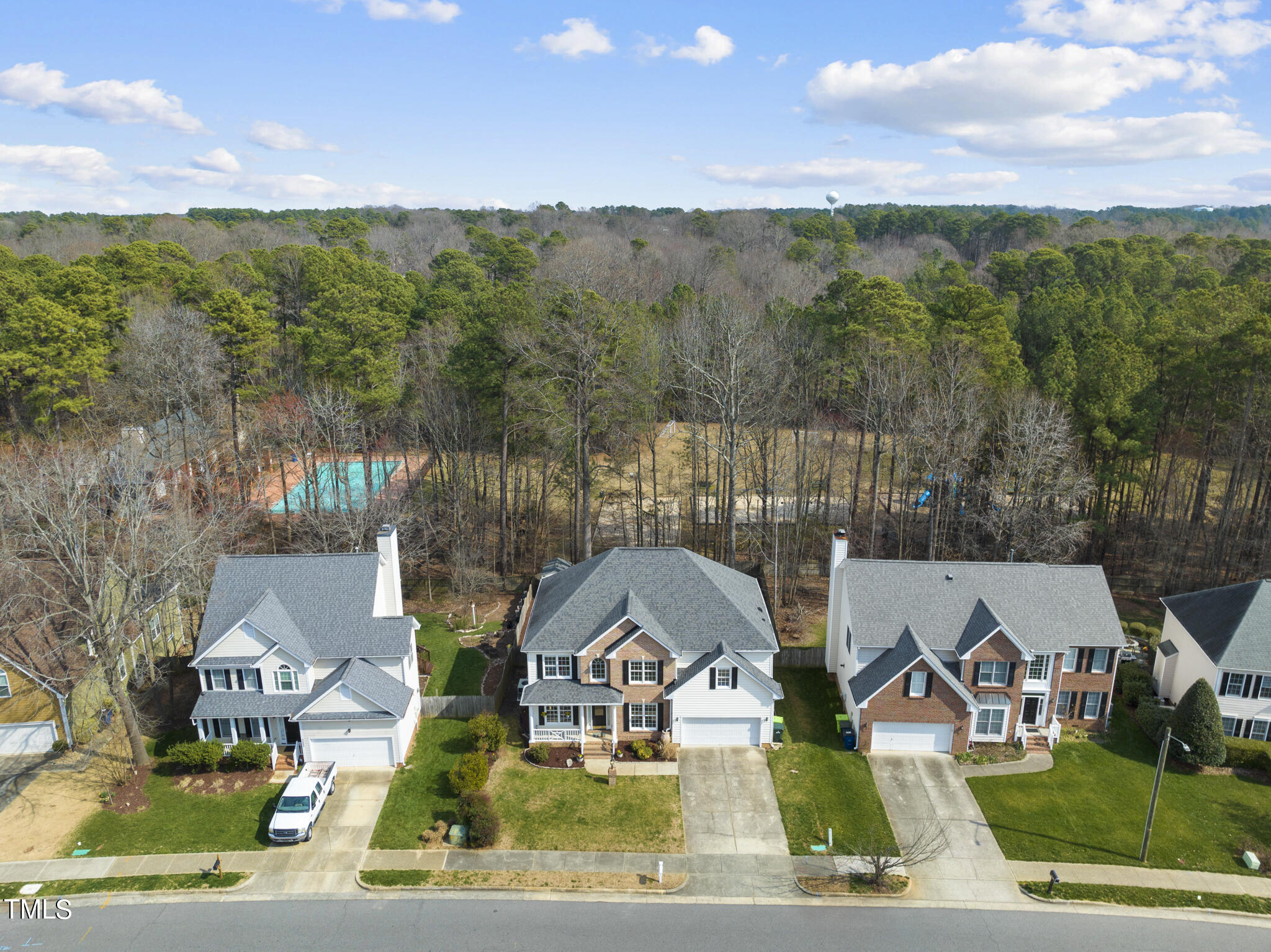 9013 Miranda Drive Raleigh, NC 27617 - Photo 33 of 41 a view of multiple houses with a yard and lake view