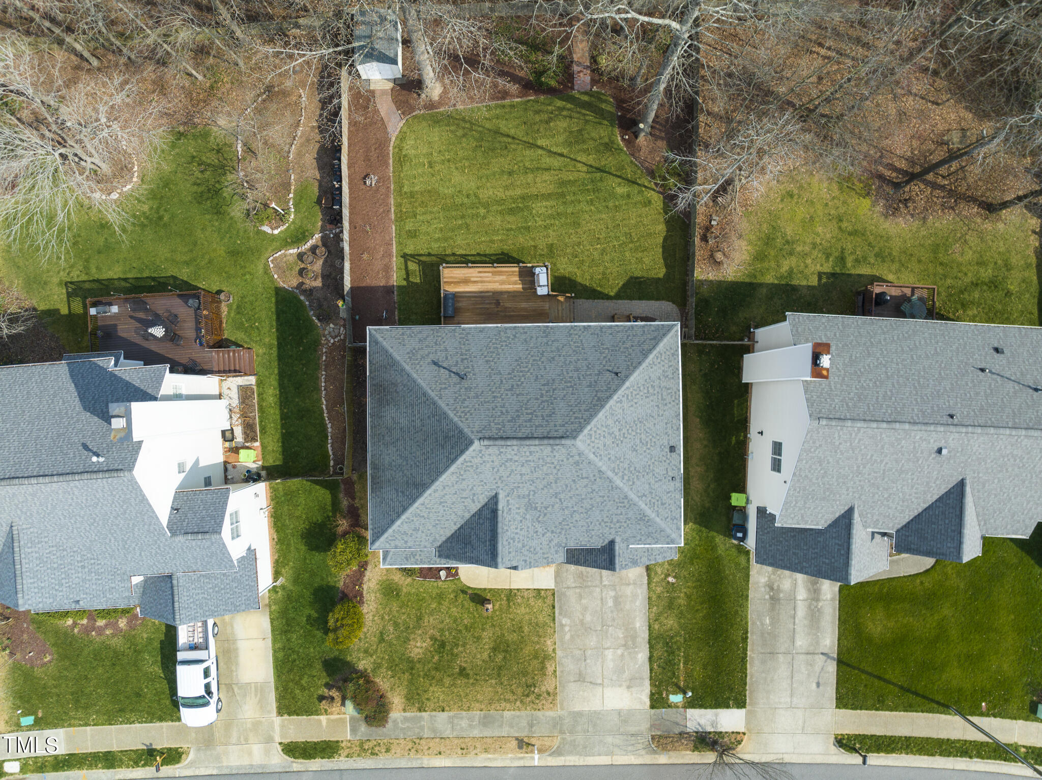 9013 Miranda Drive Raleigh, NC 27617 - Photo 39 of 41 an aerial view of a house with a garden and trees