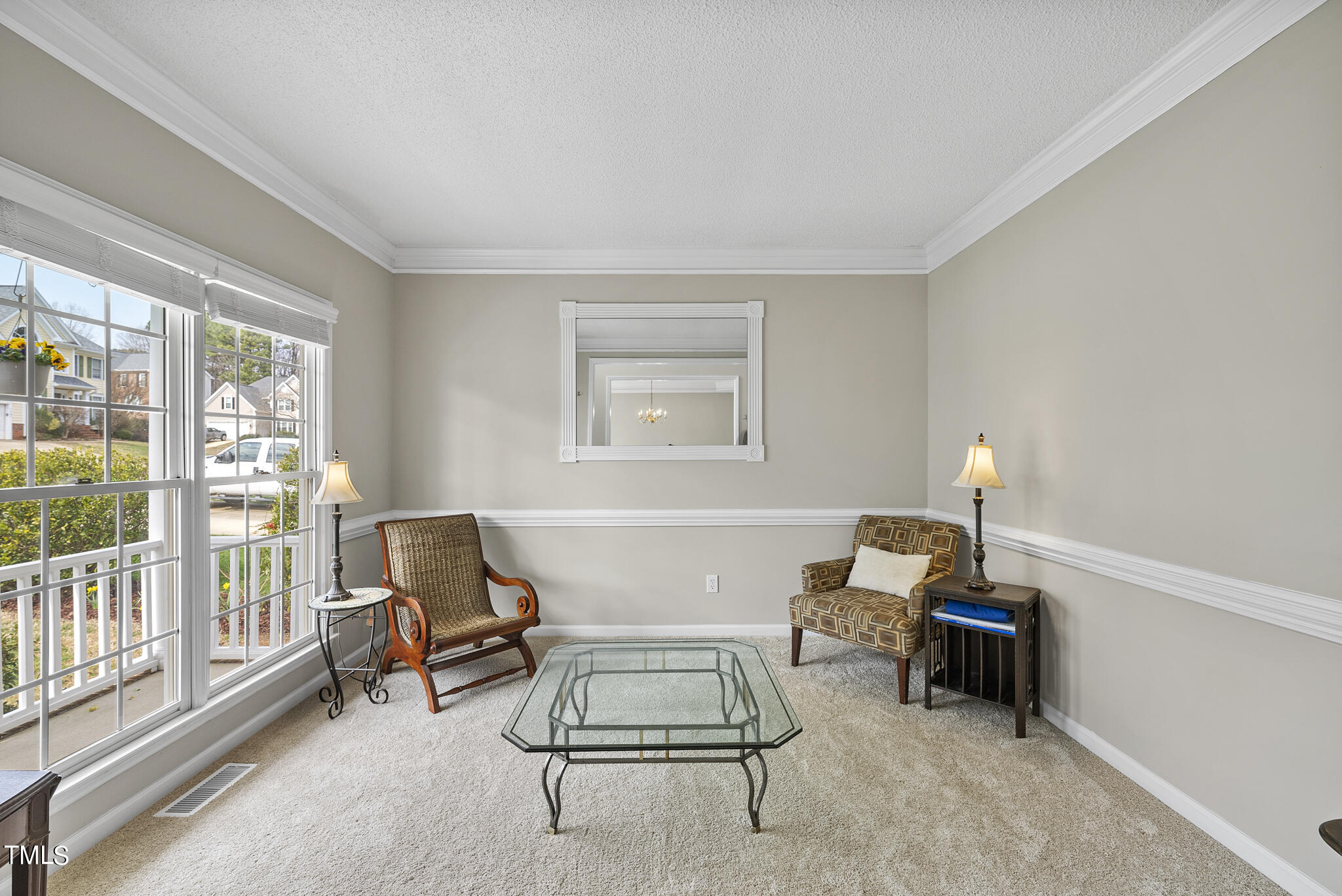 9013 Miranda Drive Raleigh, NC 27617 - Photo 4 of 41 a living room with furniture and a window