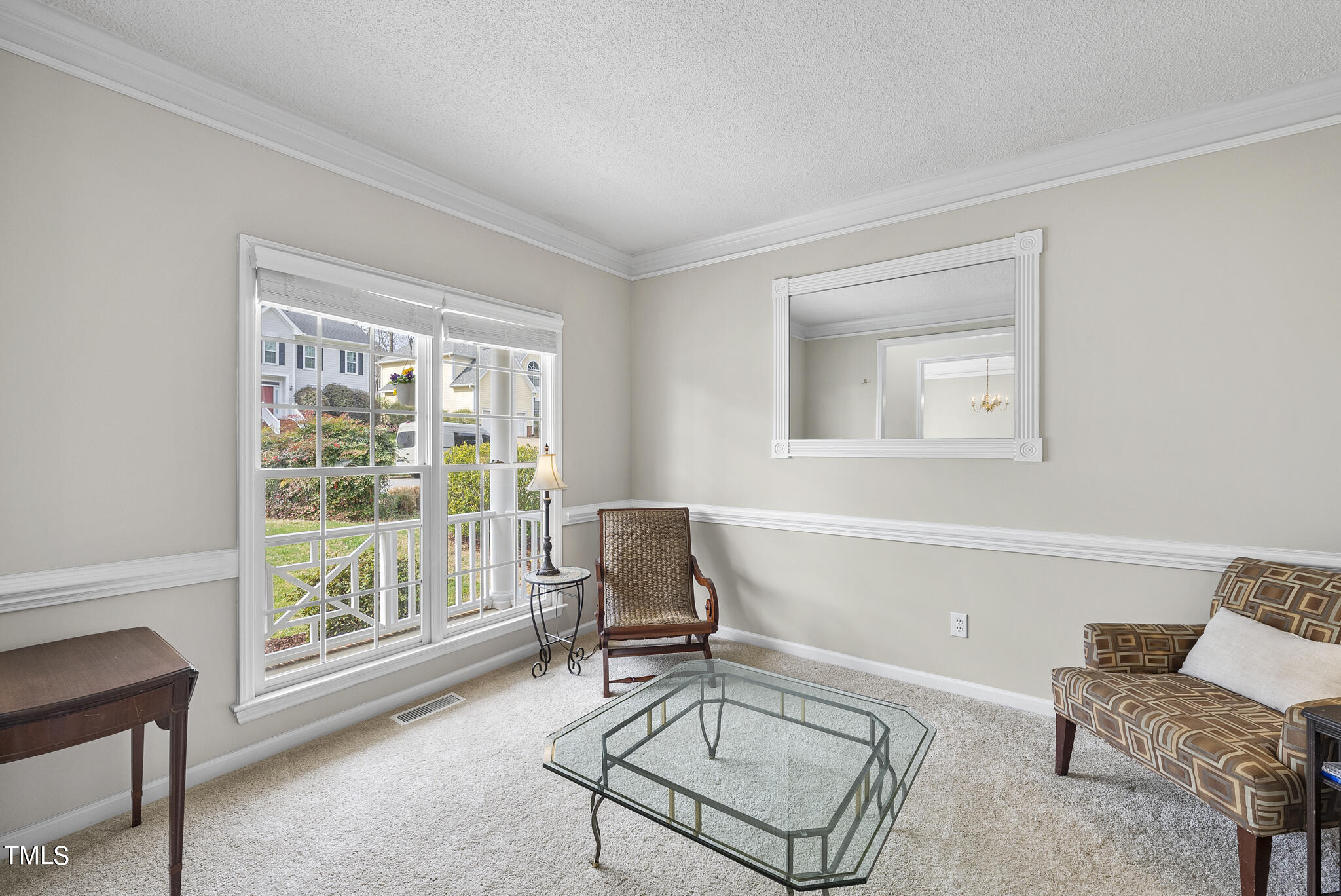 9013 Miranda Drive Raleigh, NC 27617 - Photo 5 of 41 a living room with furniture and a window