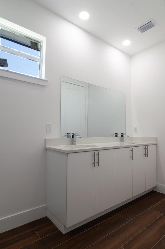 15061 Brainbridge Circle Port Charlotte, FL 33981 - Photo 18 of 21 a bathroom with a sink and mirror