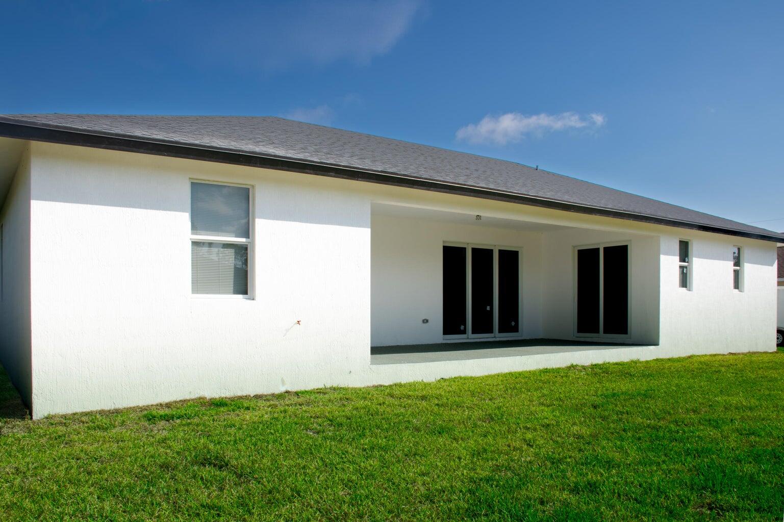 15061 Brainbridge Circle Port Charlotte, FL 33981 - Photo 20 of 21 front view of a house with a yard