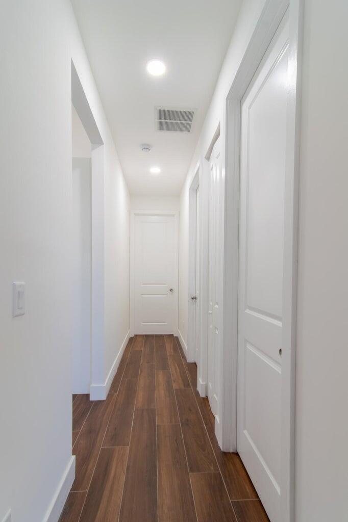 15061 Brainbridge Circle Port Charlotte, FL 33981 - Photo 10 of 21 a view of a hallway with wooden floor