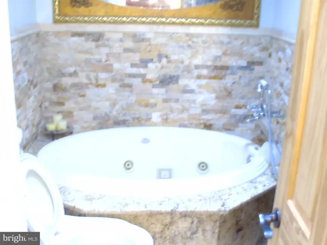 a bath tub sitting in a bathroom