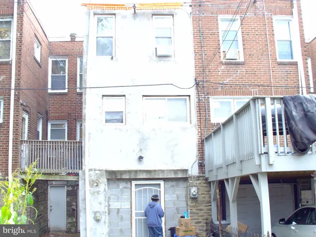a view of a building with a door and a window