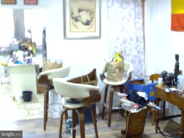 a balcony with furniture and wooden floor