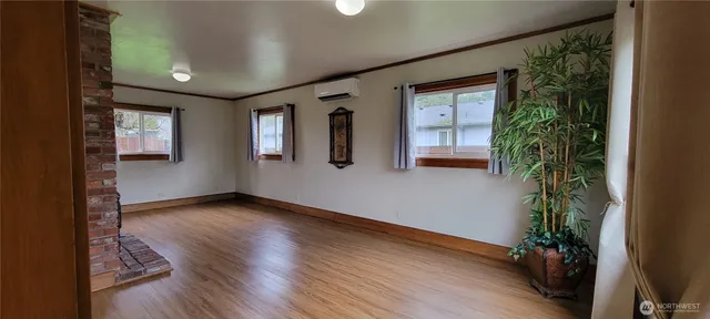a view of an entryway with wooden floor