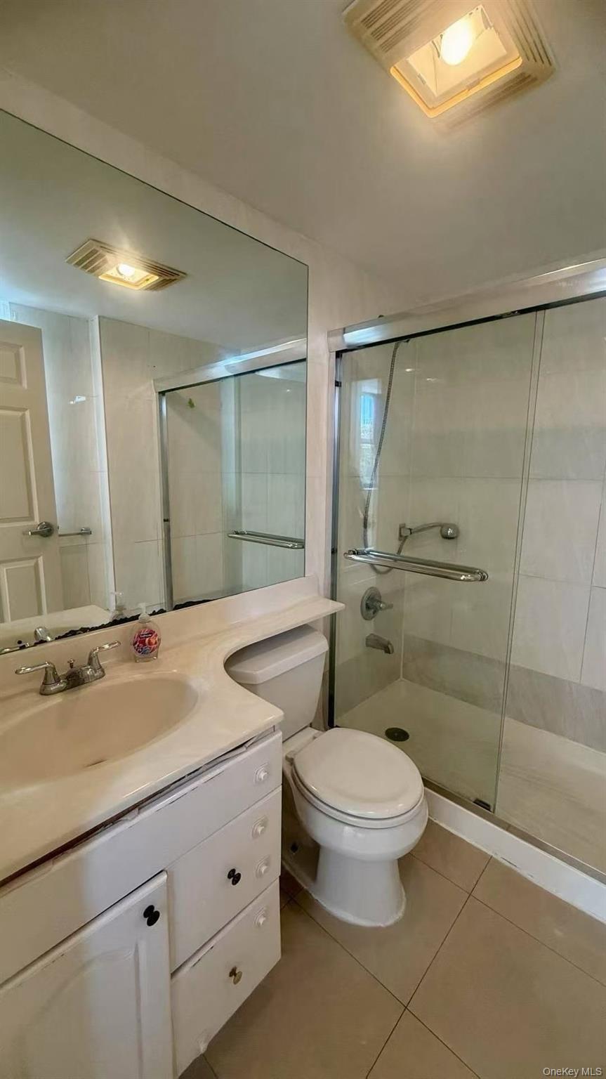 43-17 Union Street, Unit 6C Queens, NY 11355 - Photo 5 of 9 a bathroom with a granite countertop sink toilet and shower