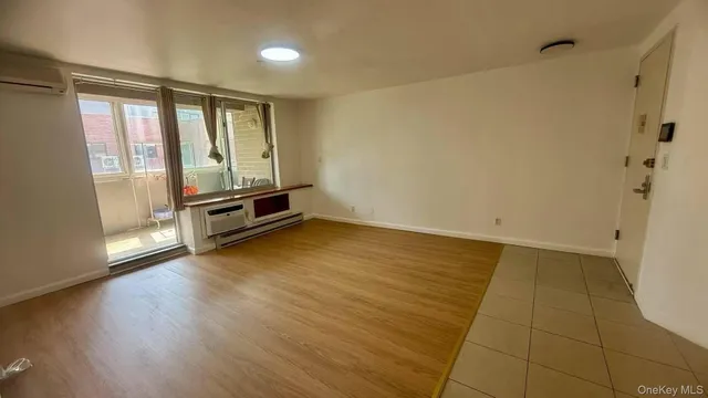 a kitchen with stainless steel appliances a sink a stove a refrigerator and cabinets