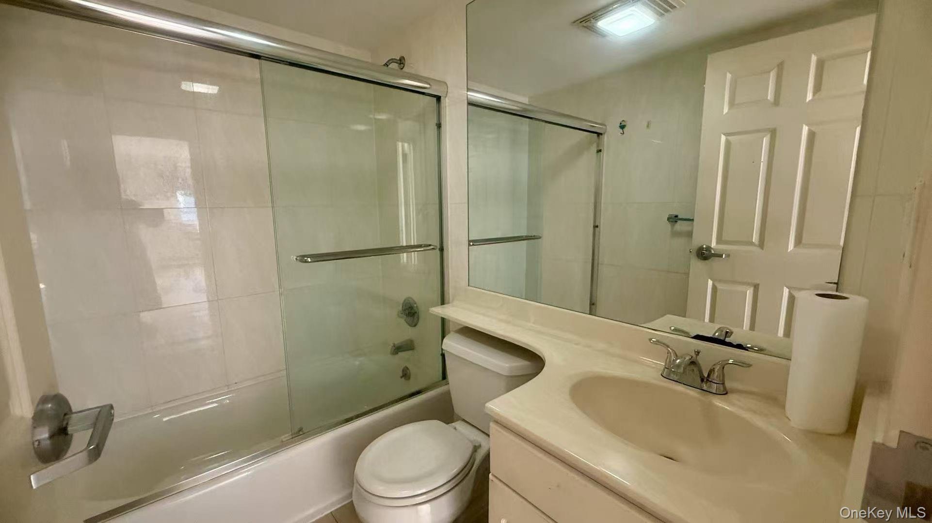 43-17 Union Street, Unit 6C Queens, NY 11355 - Photo 8 of 9 a bathroom with a sink a toilet and shower