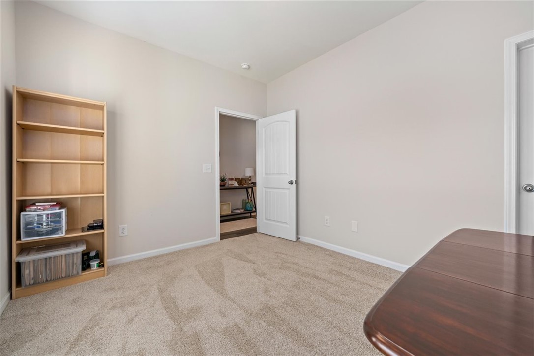 216 Carvel Trail Seneca, SC 29678 - Photo 18 of 46 This versatile room features plush carpeting and abundant natural light, offering comfort and flexibility.