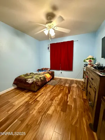 a bedroom with a bed and a mirror