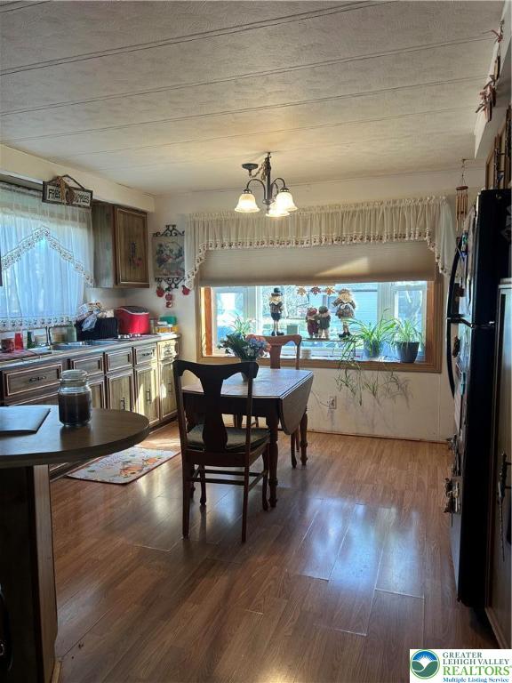7 Springridge Road Bath, PA 18014 - Photo 2 of 5 a dining room with a wooden table and chairs