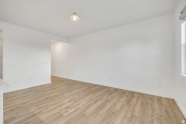 1058 Lilac Way Mapleton, UT 84664 - Photo 3 of 28 Empty room featuring light wood-style floors and baseboards