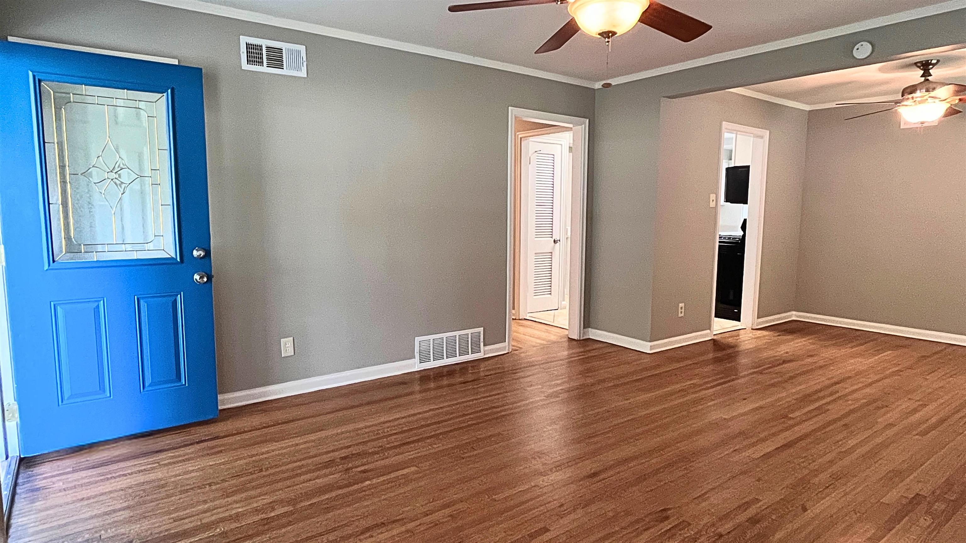 1507 Flamingo Road Memphis, TN 38117 - Photo 3 of 29 a view of an empty room with window and wooden floor
