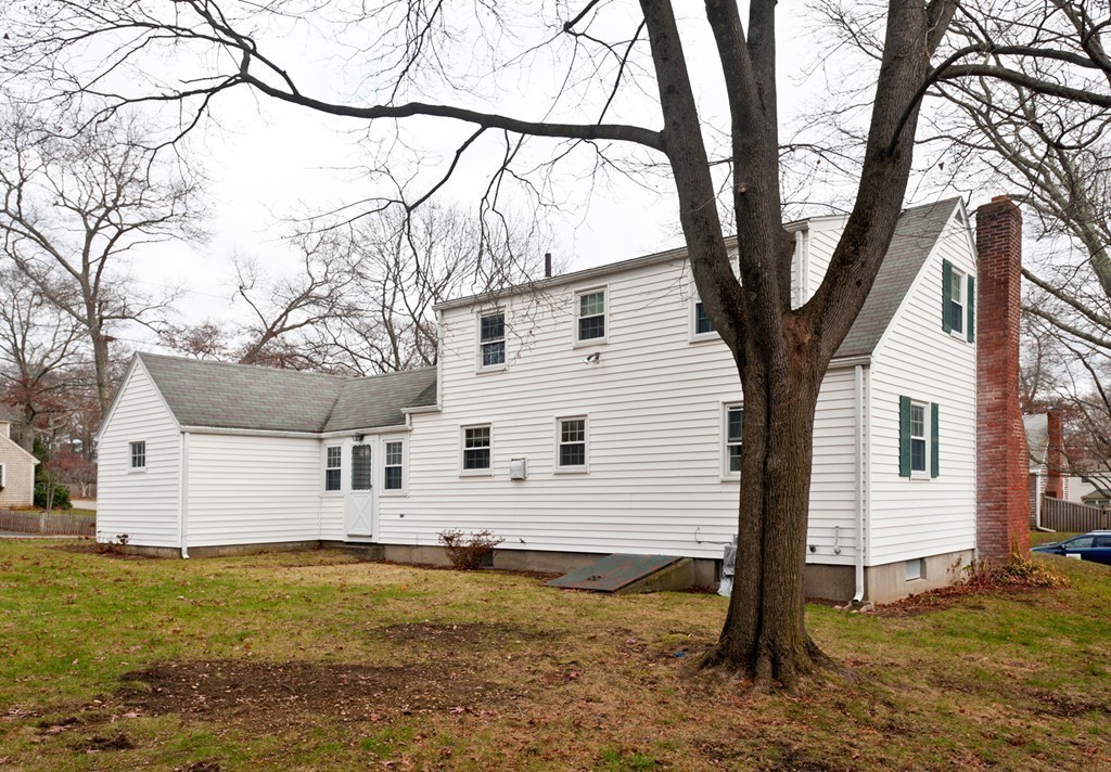 58 Franklin Road Norwell, MA 02061 - Photo 4 of 27 a white house that has a tree in front of it