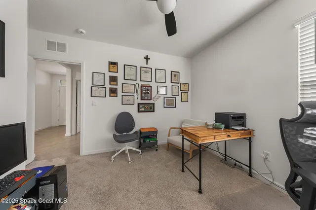 a bedroom with a bed and a lamp