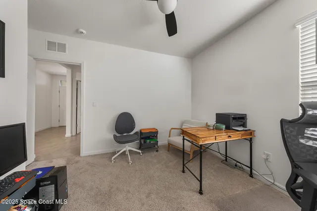 a spacious bedroom with a bed and a window