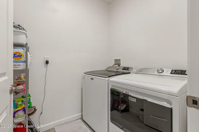 a kitchen with granite countertop a sink and cabinets