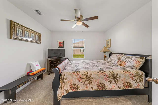 a kitchen with a sink and chairs