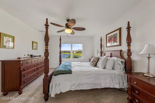 a kitchen with granite countertop a sink stainless steel appliances and white cabinets