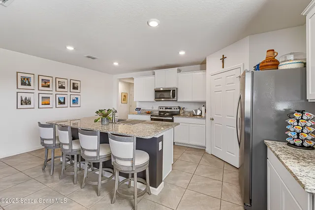 a view of a livingroom with furniture and entryway
