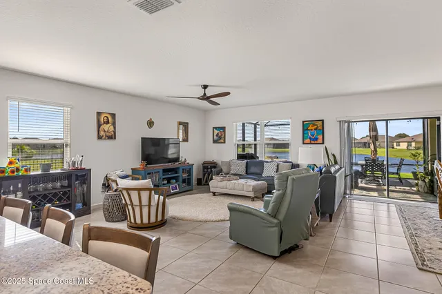 an aerial view of a house with a garden and yard