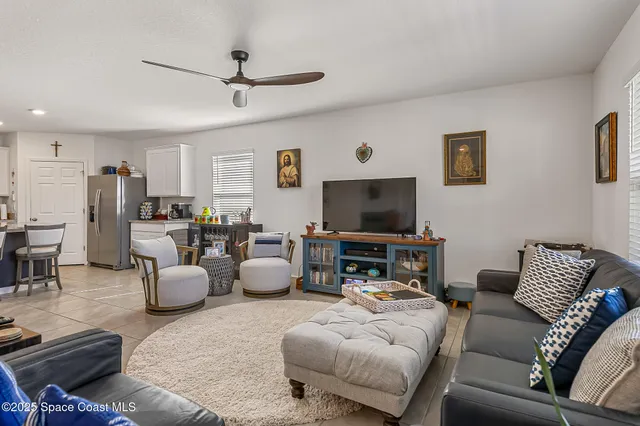 a green field with trees in the background