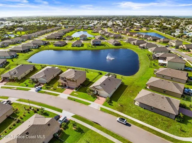 a backyard of a house with potted plants