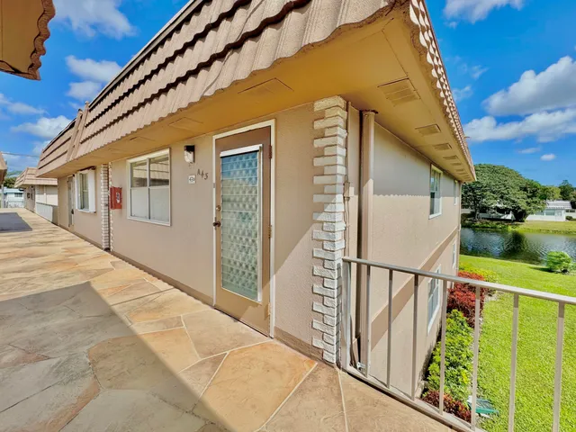 a view of balcony with wooden floor and stairs
