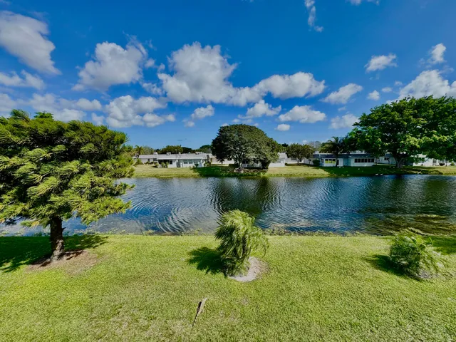 a view of a lake with a building in the background