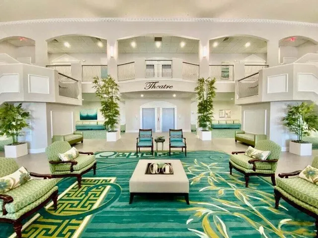 a living room filled with furniture and a table