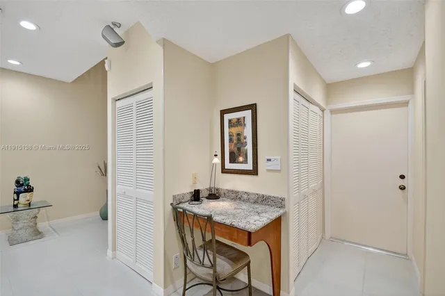 a view of kitchen island with furniture and wooden floor