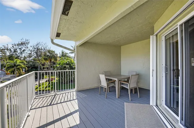 a spacious bathroom with a double vanity sink a mirror and a bathtub