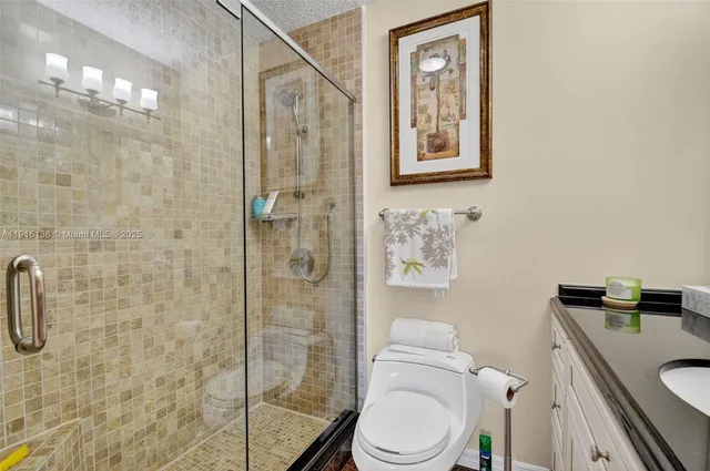 an aerial view of residential houses with outdoor space and swimming pool