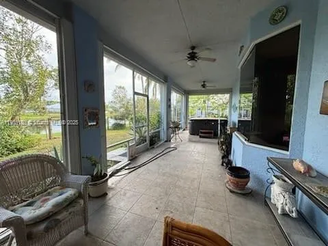 a room with furniture and a large window