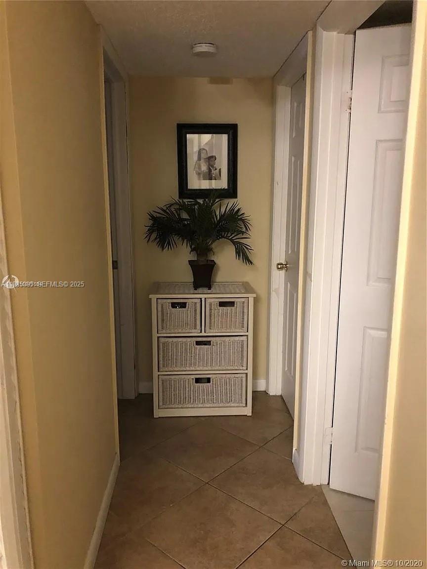 9440 Southwest 8th Street, Unit 402 Boca Raton, FL 33428 - Photo 11 of 19 a view of a hallway