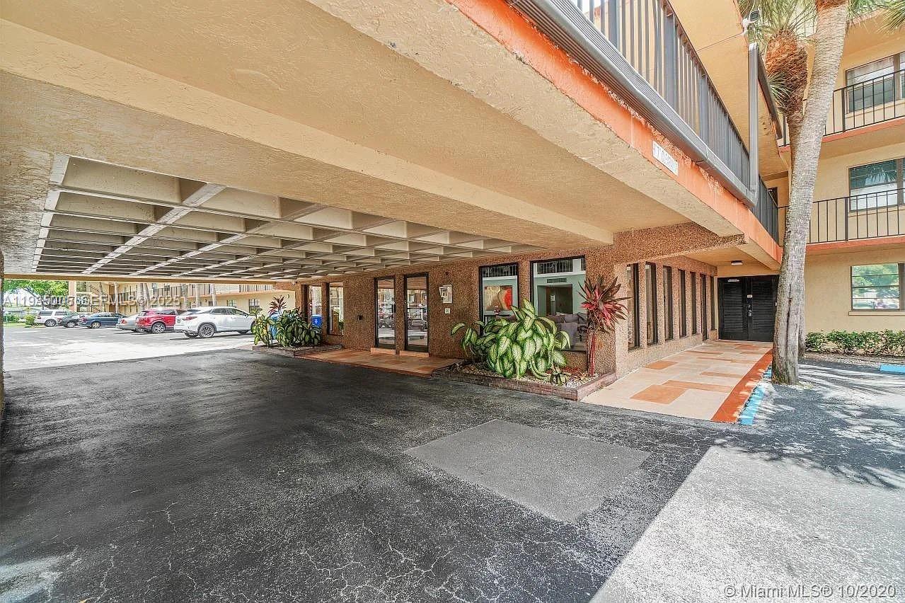 9440 Southwest 8th Street, Unit 402 Boca Raton, FL 33428 - Photo 15 of 19 a view of a building with a street