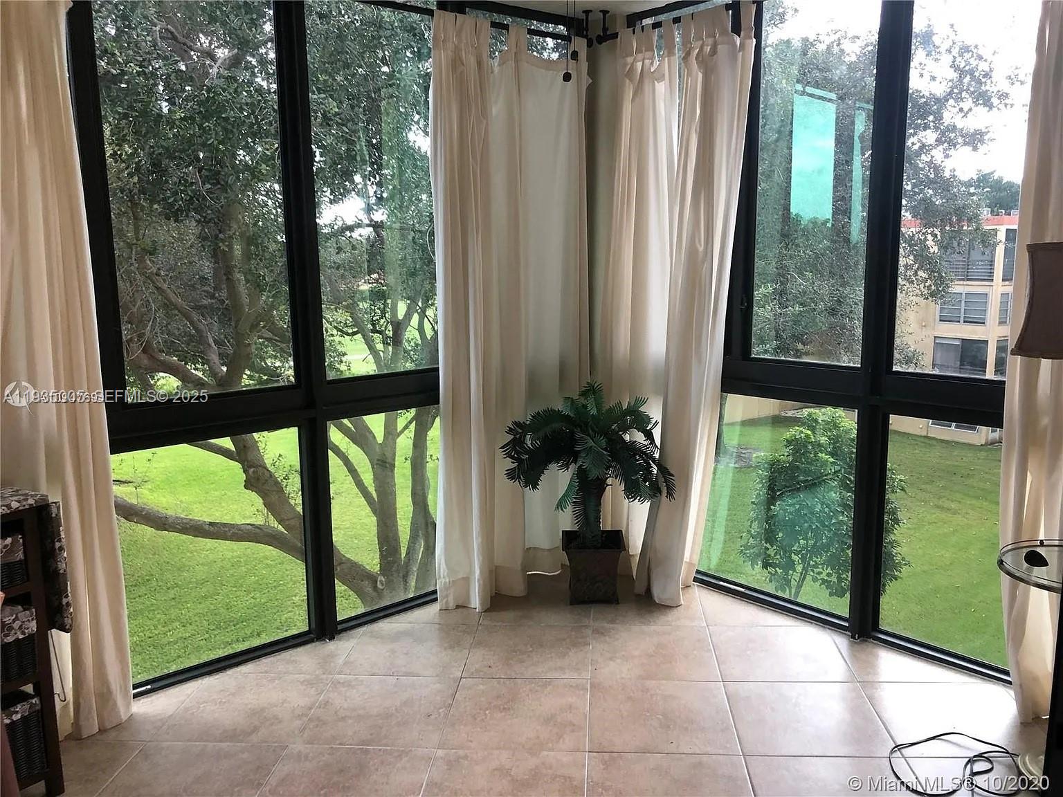 9440 Southwest 8th Street, Unit 402 Boca Raton, FL 33428 - Photo 19 of 19 a view of a garden with plants