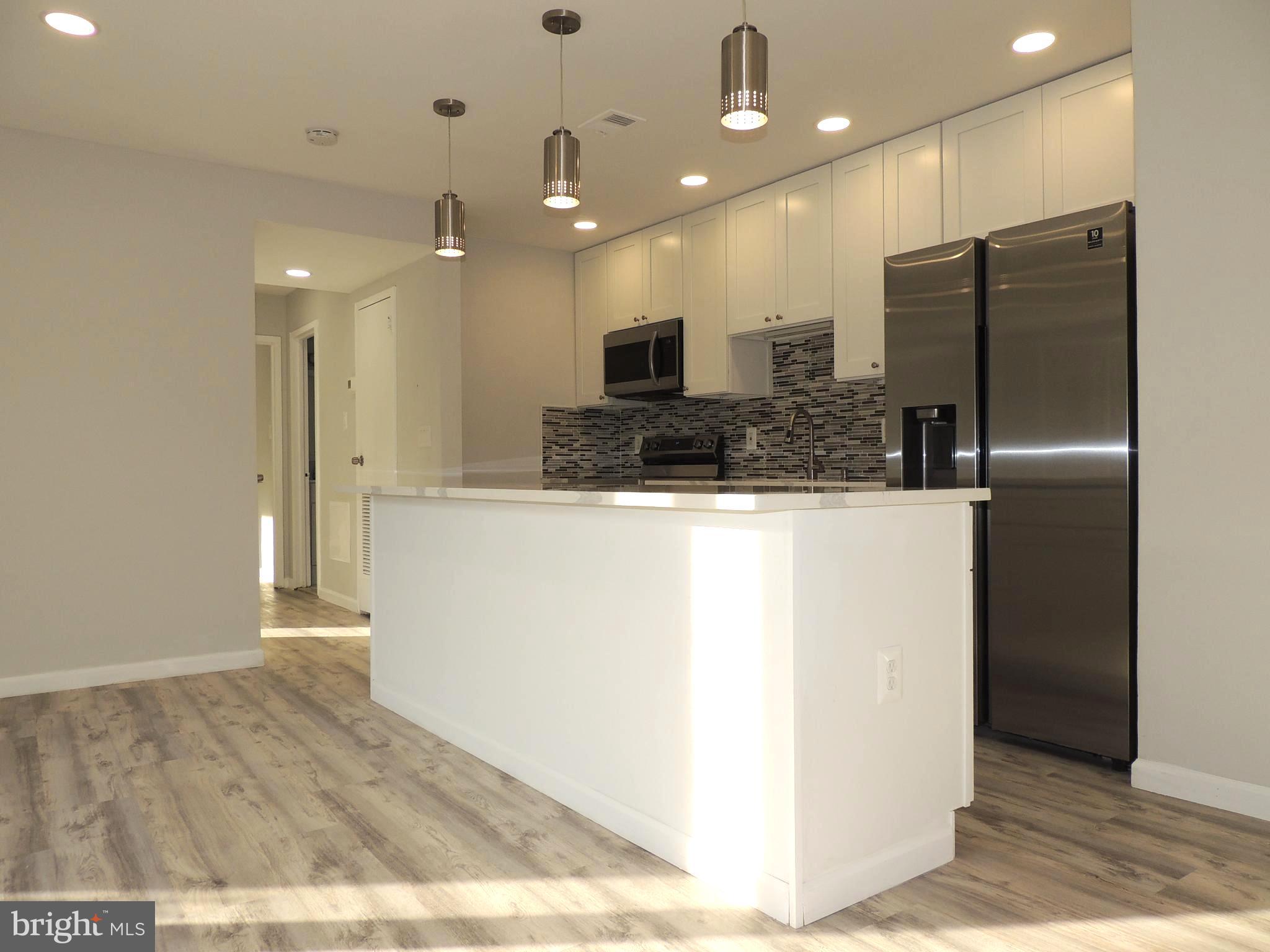 3812 Bel Pre Road, Unit 38122 Silver Spring, MD 20906 - Photo 8 of 34 Recessed and pendant lights