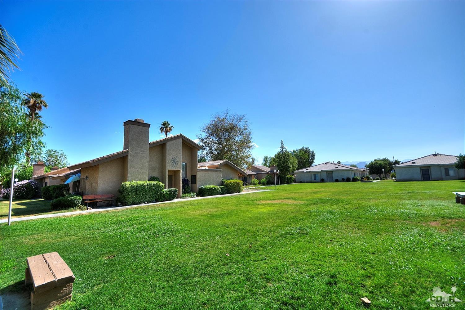 47395 Monroe Street, Unit 191 Indio, CA 92201 - Photo 2 of 21 a house view with a garden space