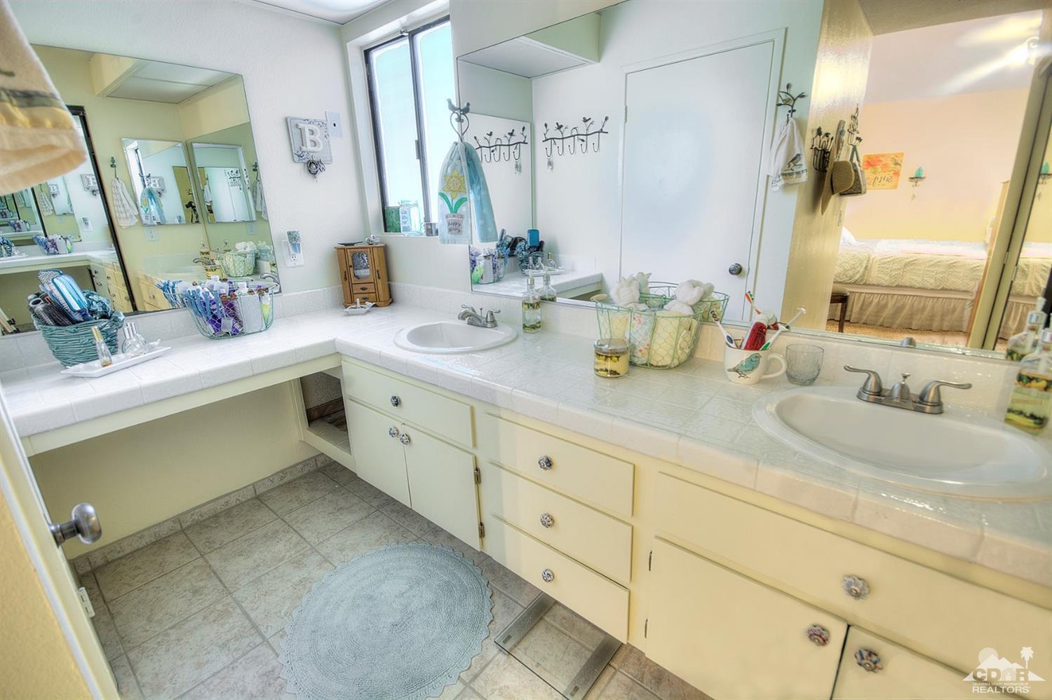 47395 Monroe Street, Unit 191 Indio, CA 92201 - Photo 11 of 21 a bathroom with double sink and a mirror