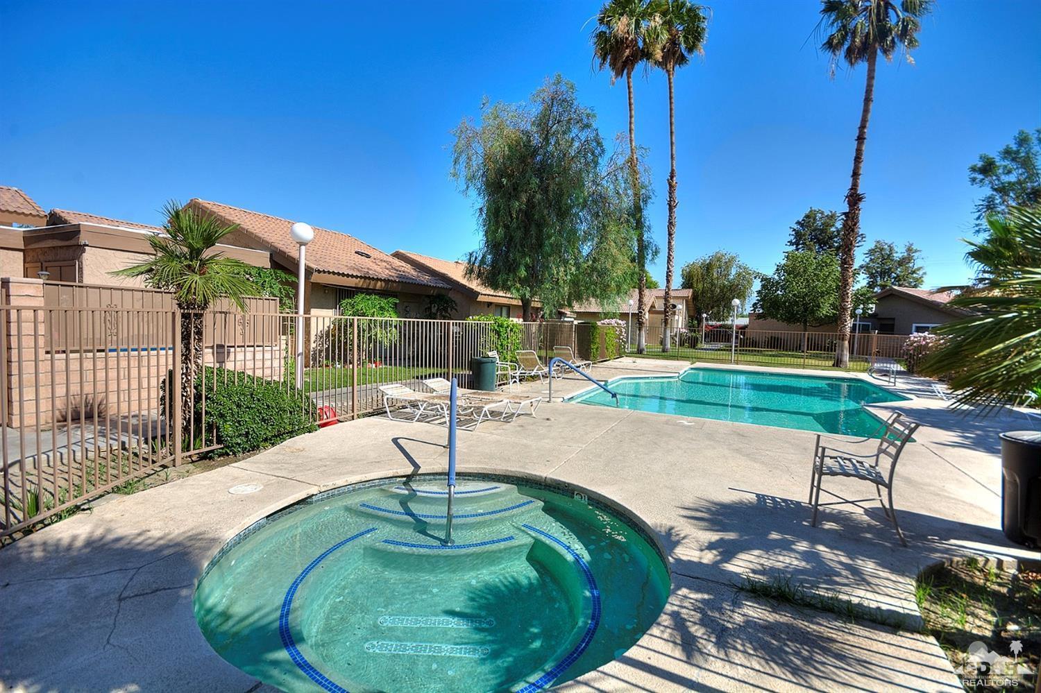 47395 Monroe Street, Unit 191 Indio, CA 92201 - Photo 21 of 21 a swimming pool with lots of tress in front of it