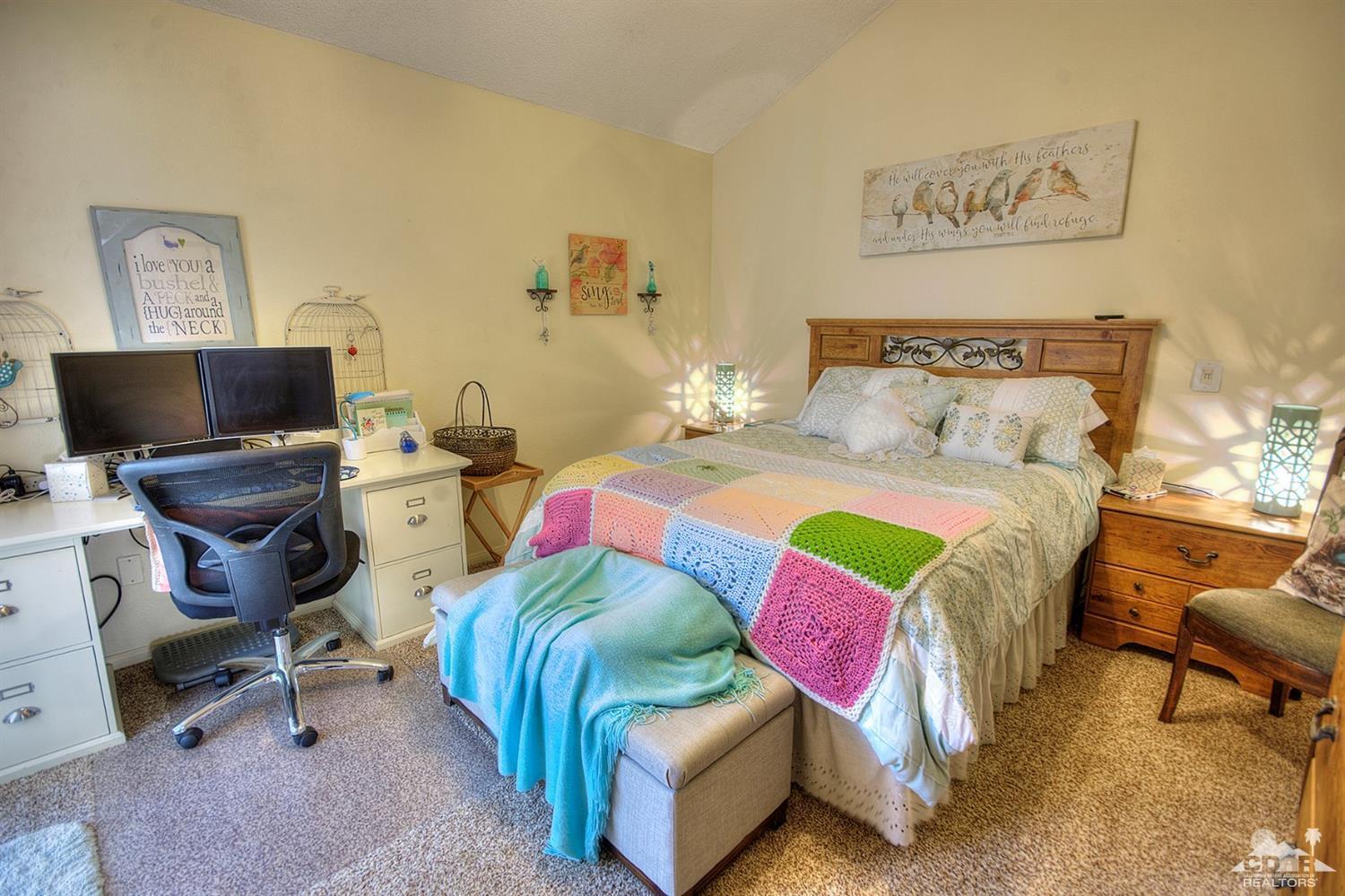 47395 Monroe Street, Unit 191 Indio, CA 92201 - Photo 8 of 21 a bedroom with a bed and furniture