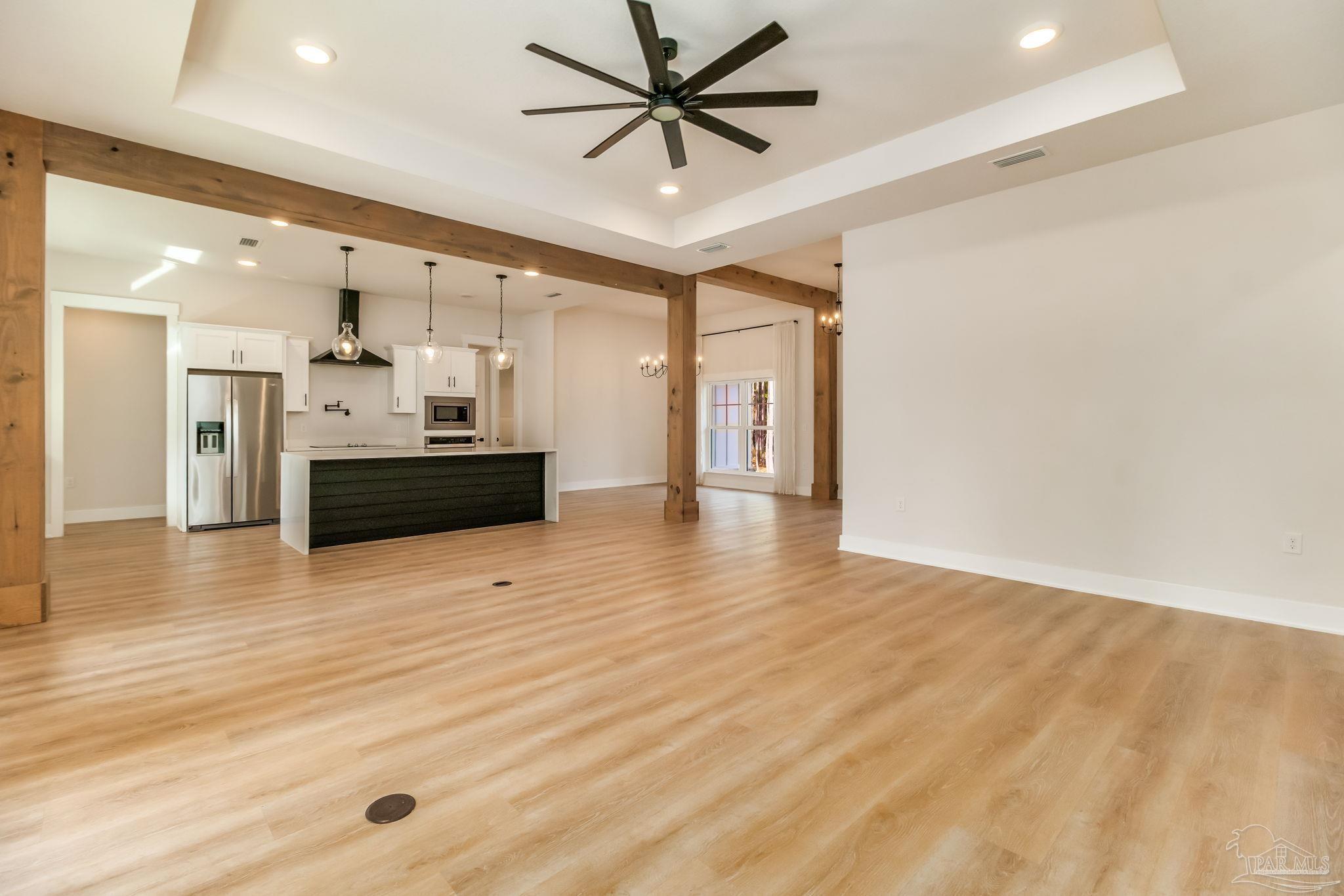 2329 Molino Bridge Road Pace, FL 32571 - Photo 13 of 65 a view of a kitchen with a sink and a refrigerator