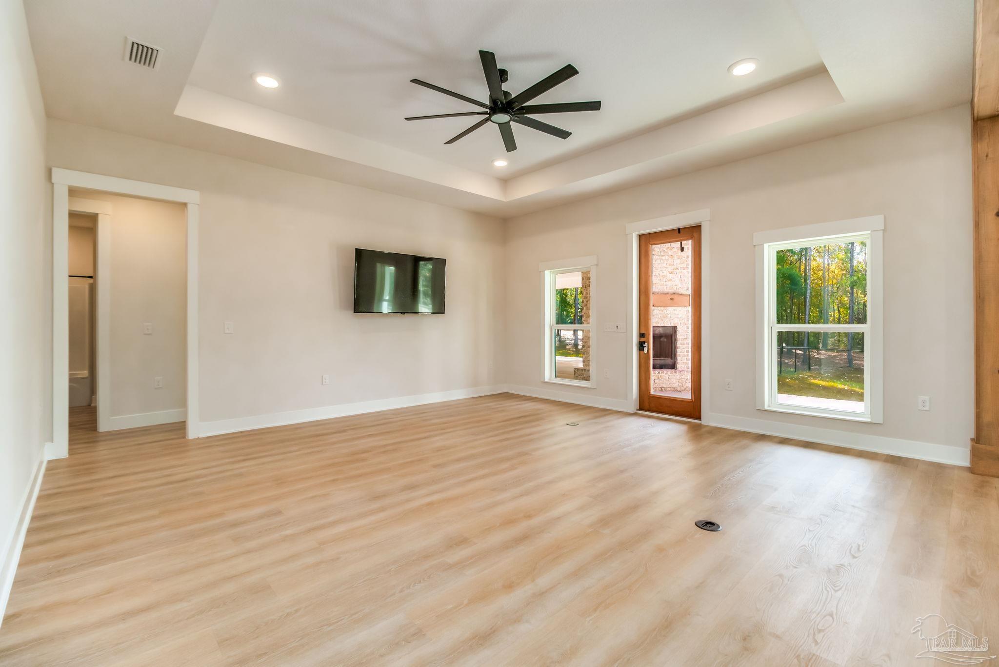 2329 Molino Bridge Road Pace, FL 32571 - Photo 20 of 65 a view of an empty room with window and wooden floor