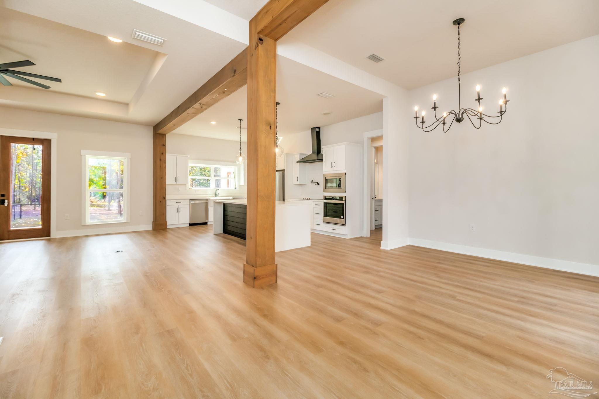 2329 Molino Bridge Road Pace, FL 32571 - Photo 26 of 65 a view of a livingroom with a furniture wooden floor and windows
