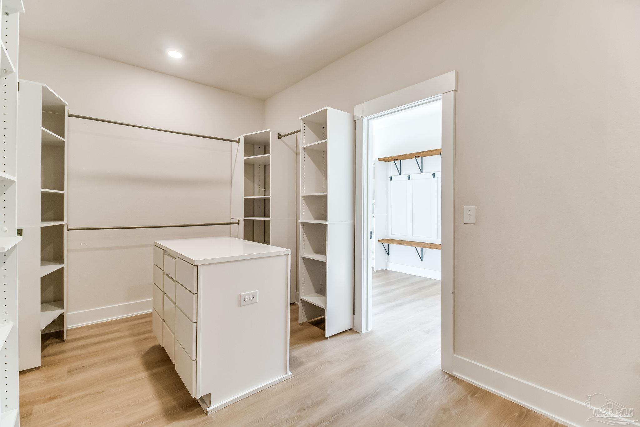 2329 Molino Bridge Road Pace, FL 32571 - Photo 37 of 65 a view of an empty room with wooden floor and a window