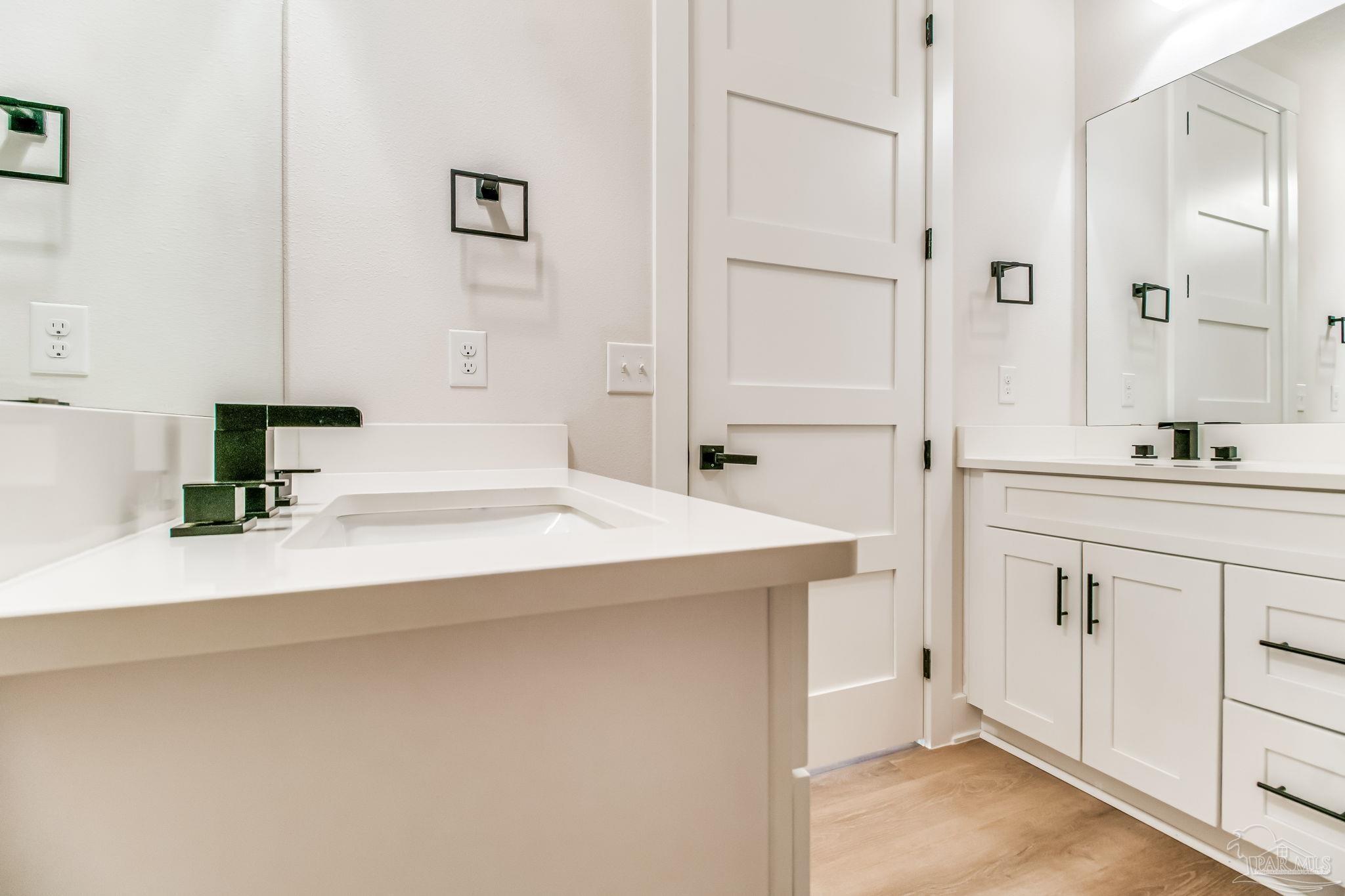 2329 Molino Bridge Road Pace, FL 32571 - Photo 40 of 65 a bathroom with a sink and a mirror